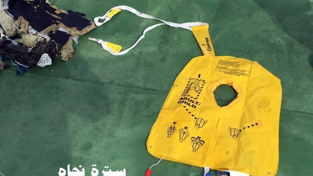 This picture on the official Facebook page of the Egyptian Armed Forces spokesman shows a life vest from EgyptAir flight 804. Search crews found floating human remains, luggage and seats from the doomed EgyptAir jetliner Friday but face a potentially more complex task in locating bigger pieces of wreckage and the black boxes vital to determining why the plane plunged into the Mediterranean. Arabic reads: ? Life vest?.  (Egyptian Armed Forces via AP)