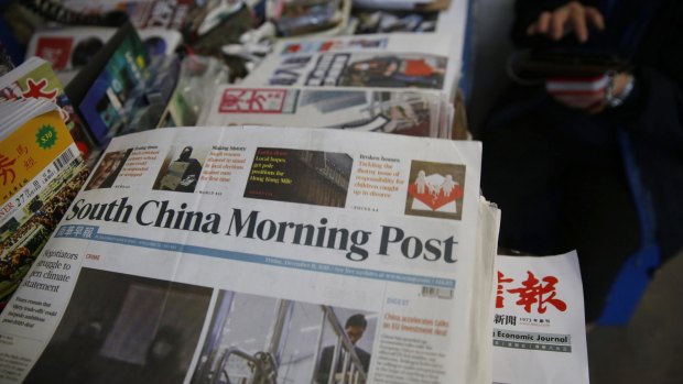 Copies of the South China Morning Post are sold at a news stand in Hong Kong. Chinese e-commerce giant Alibaba says it is buying Hong Kong's leading English language newspaper. 