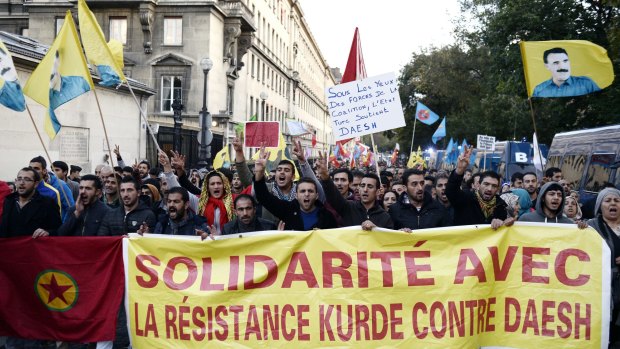 Supporters of the Kurdistan Workers' Party or PKK demonstrate in support of their Kurdish brethren fighting Islamic State in Paris.