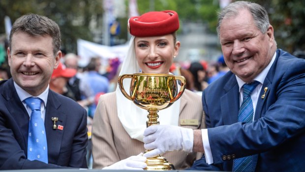 Victoria Racing Committee chairman Michael Burn and lord mayor Robert Doyle hold the Melbourne Cup. 