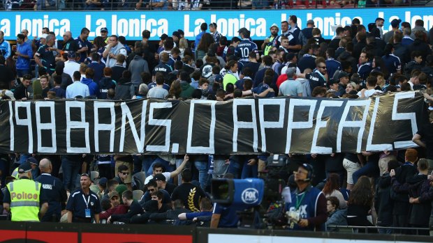 Melbourne Victory fans hold up a sign to make their feelings known during the round eight match against Adelaide United at Etihad Stadium on November 28.