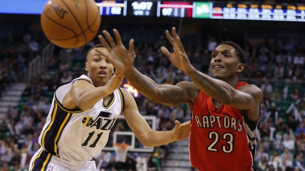 Battling for court time: Dante Exum, who was taken fifth in the draft by Utah, vies for possession with Toronto guard Lou Williams.