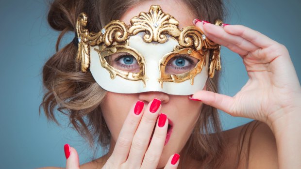 woman with venetian mask gesturing surprise studio shot closeup new year's ball