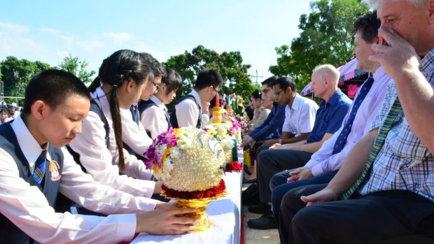 Students at the Narinukun school pay respect to teachers during a Thai ceremony on June 26, 2015. 
Peter Dundas Walbran is third from right, wearing blue short-sleeve shirt. 