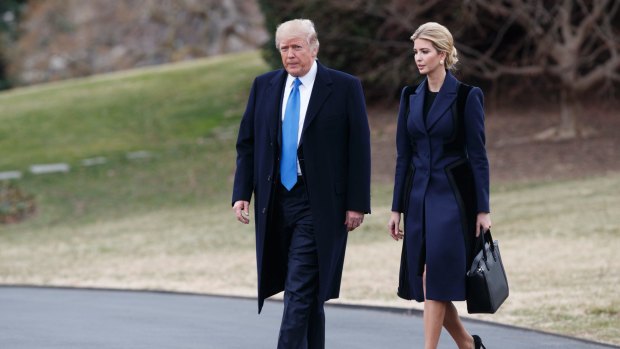 President Donald Trump and his daughter Ivanka walk to board Marine One on the South Lawn of the White House in Washington.