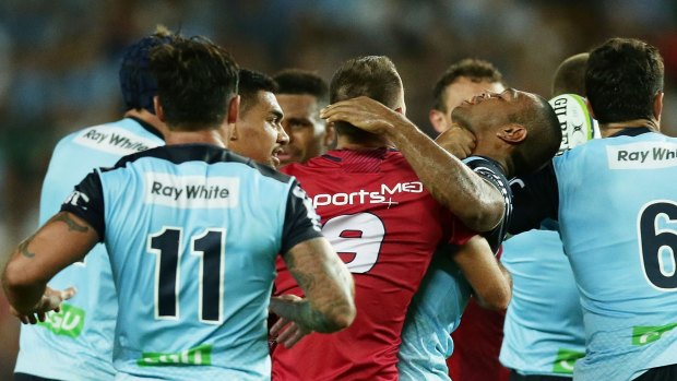 Push and shove: Kurtley Beale is involved in a scuffle with the Reds. 