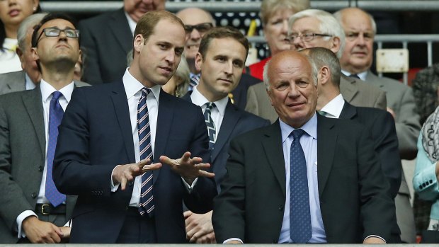 Britain's Prince William gestures as he stands with FA chairman Greg Dyke after the English FA Cup final between Aston Villa and Arsenal.