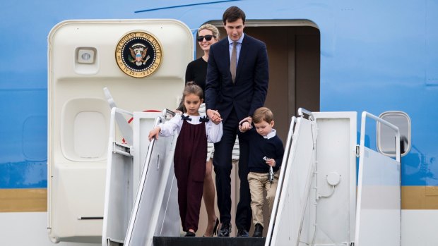Ivanka Trump, her husband Jared Kushner and their children disembark Air Force One in Florida.