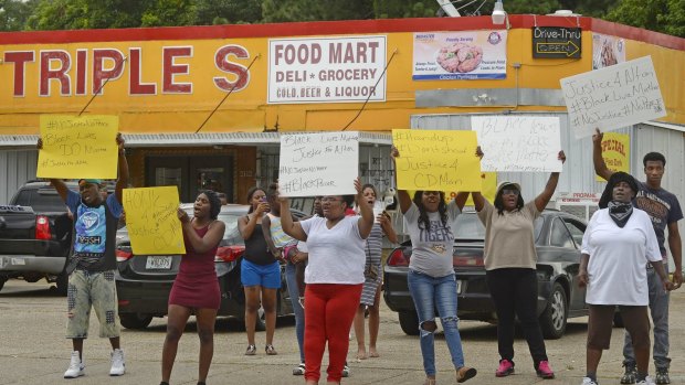 Family and friends of Alton Sterling protest on Tuesday afternoon.