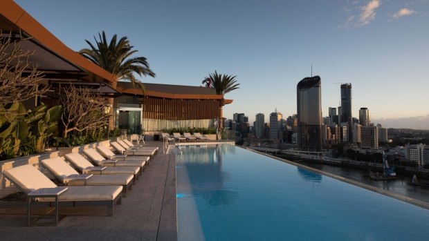The hotel's 23-metre heated rooftop pool overlooks the river.
