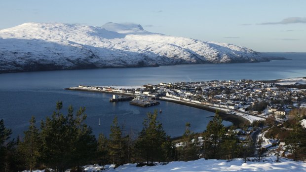 Ullapool and loch broom with the mountain of beinn ghobhlach in the distance.