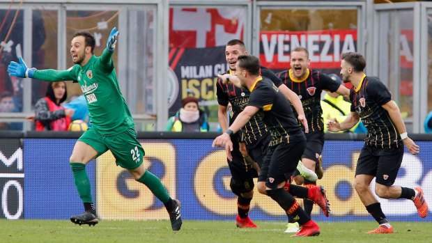 Benevento goalkeeper Alberto Brignoli (left) celebrates after scoring the equaliser at the end of the Italian Serie A soccer match between Benevento and AC Milan.