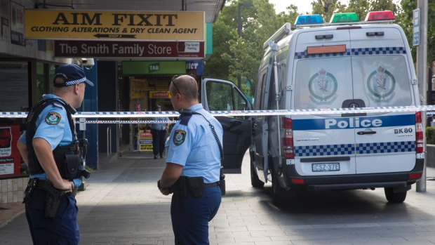 Police at the scene where Ho Ledinh was shot dead in Bankstown on Tuesday.

