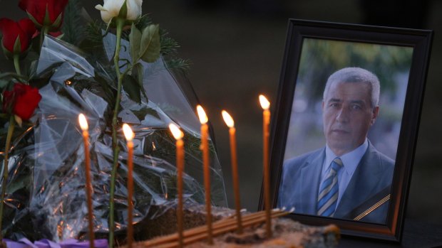 Flowers, candles and a picture of Kosovo Serb politician Oliver Ivanovic, who was assassinated.