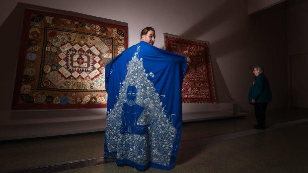 Lucas Grogan with his quilt The Shroud.