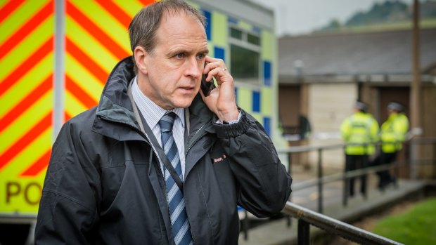 <i>Happy Valley's</i> harried police detective John Wadsworth (Kevin Doyle), trying to decipher a mumbled phone call.