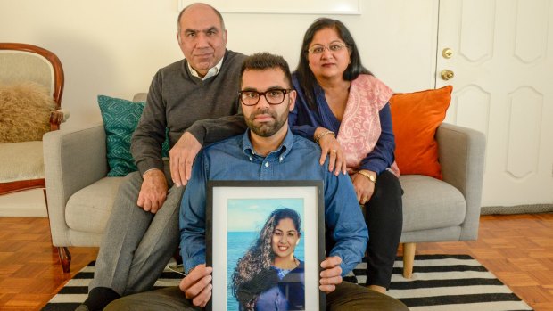 Nikita Chawla's  parents Umesh and Sunila and brother Tarang with a picture of Nikita.