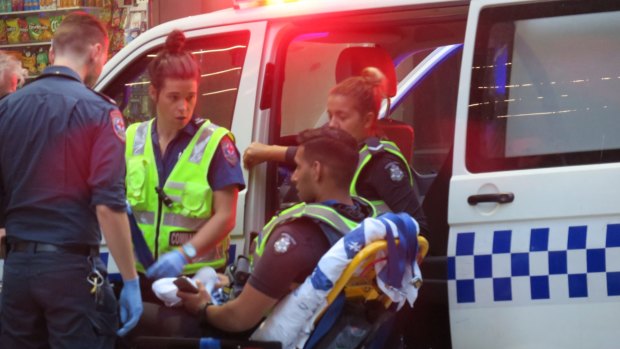 A police officer injured in the arrest of a man in Collins Street in the CBD.