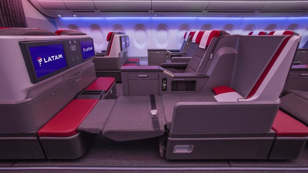  Each grey and red seat reclines fully to a flat-bed 23 inches (58 centimetres) wide and 73 inches (185 centimetres) long and has a universal power point, a USB port, a reading light, a pull-up privacy screen and storage space under the padded footrest.
