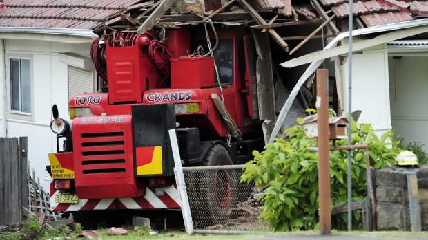 The truck crashes through the front of the house in Pendle Hill.