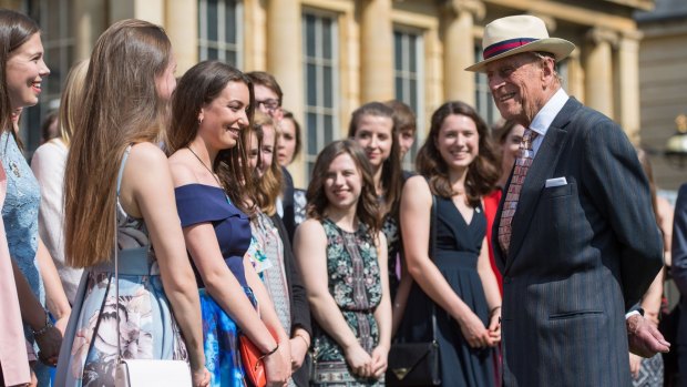 Prince Philip presents the Duke of Edinburgh's Award to gold level participants at Buckingham Palace in 2017.