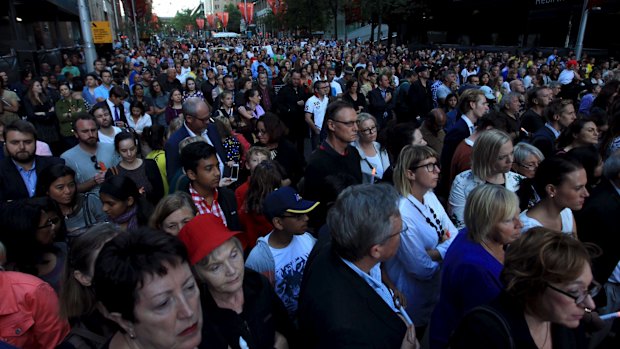 A large crowd gathers for the vigil. 