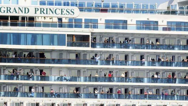 Passenger aboard the Grand Princess celebrate as they dock in Oakland, California.