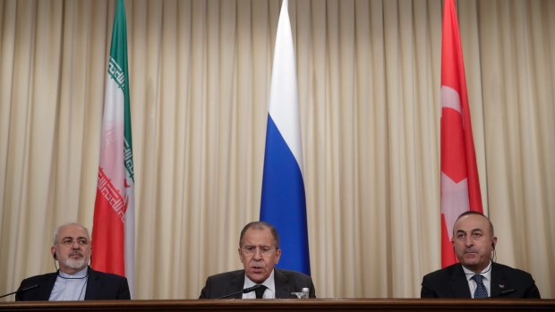 Iranian Foreign Minister Mohammad Javad Zarif, left, Russian Foreign Minister Sergei Lavrov, centre, and Turkish Foreign Minister Mevlut Cavusoglu at a joint press conference after their talks in Moscow.