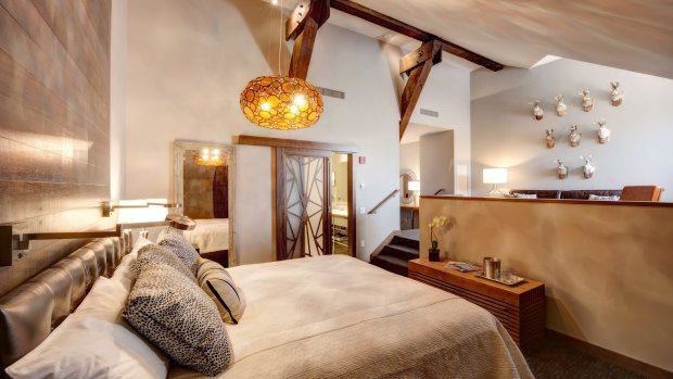 Exposed wooden beams and subtle mood lighting: Rooms at the hotel have been designed like loft-style apartments.