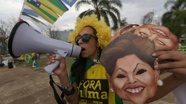 A demonstrator shouts slogans against Brazilian President Dilma Rousseff outside the Federal Court of Accounts in Brasilia last week.