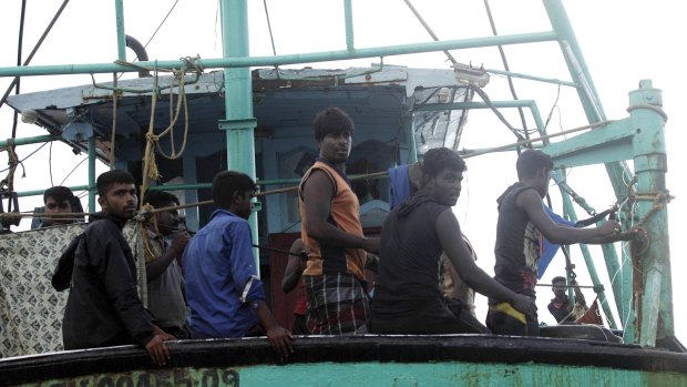 Sri Lanka refugees wait for help from the Indonesia Government after their wooden boat drifted off the Indonesian coast, on Saturday.