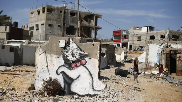 A mural of a playful-looking kitten, presumably painted by British street artist Banksy, in Beit Hanoun.