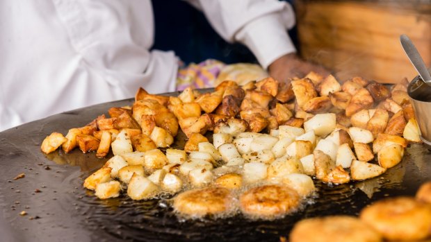 A roadside potato snack is among the delights to be found on the streets of Old Delhi.