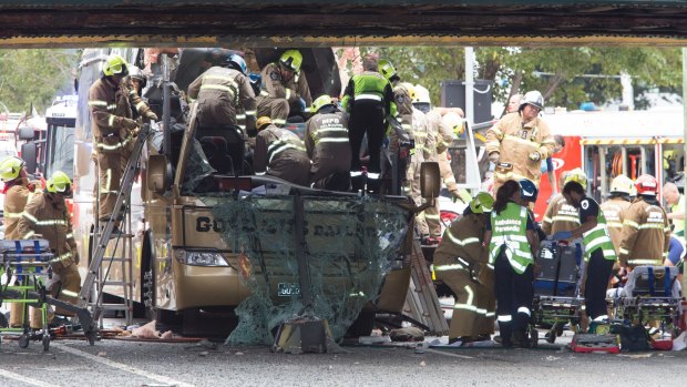 It took firefighters nearly an hour to free four people trapped inside the bus.