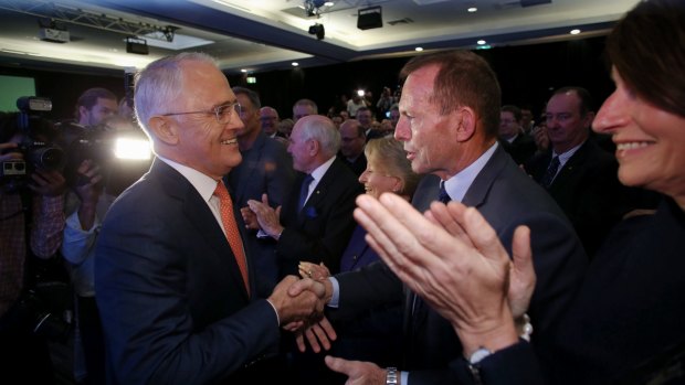 Mr Turnbull greets Mr Abbott before the launch.