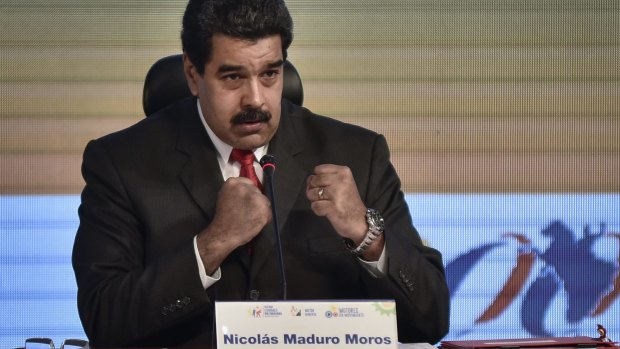 Venezuelan President Nicolas Maduro gestures during a meeting with mining companies in Caracas.
