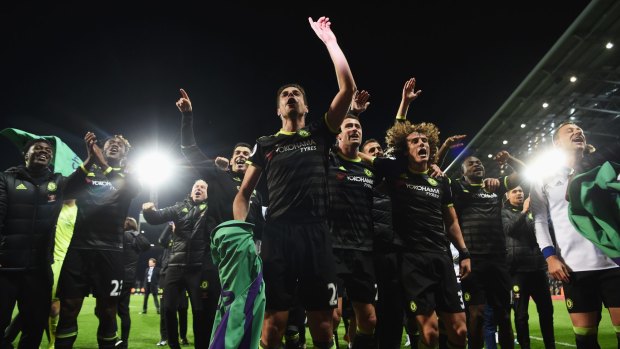 Champions: The Chelsea team celebrate winning the league after beating West Brom.
