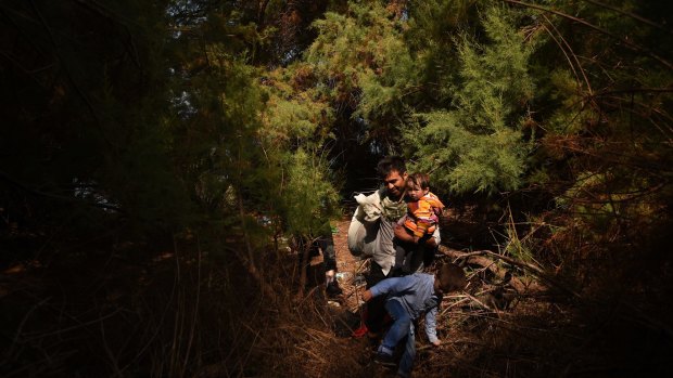 An Afghan family moments after they arrived at the Greek island of Lesvos on a rubber dinghy. 