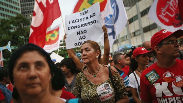 Supporters of President Dilma Rousseff gather at a rally in Rio on March 31.
