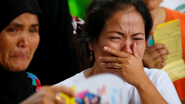 Displaced residents of Marawi cry upon receiving assurance of support from local officials at an evacuation centre in southern Philippines on Wednesday.
