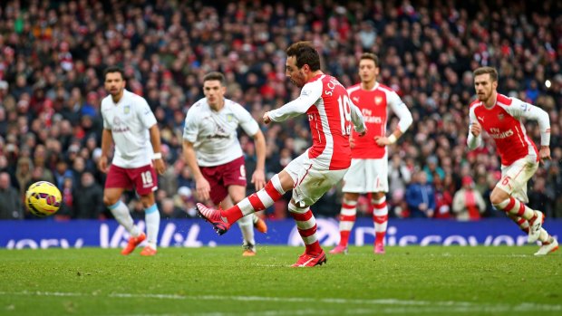 Santi Cazorla of Arsenal scores from the penalty spot during his team's 5-0 drubbing of Aston Villa on Sunday. 