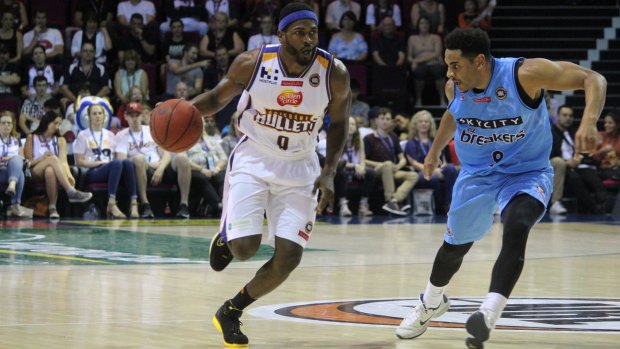 Brisbane Bullets import Jermaine Beal drives past Breakers guard Corey Webster to score two of his nine points in the Bullets victory at the Brisbane Exhibition and Convention Centre on Saturday night.