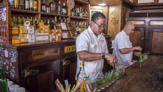 Preparing Havana's signature cocktail, the mojito. 