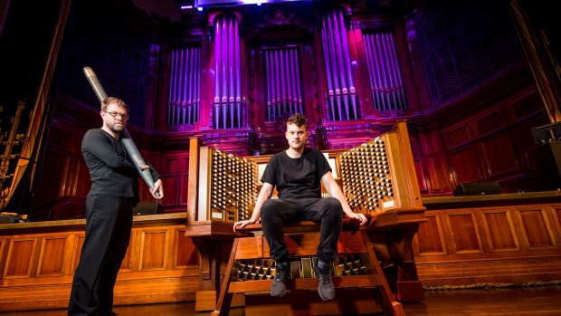 Composers Austin Buckett and Simon James Phillips, who is holding one of the organ pipes removed for Exit Ceremonies.