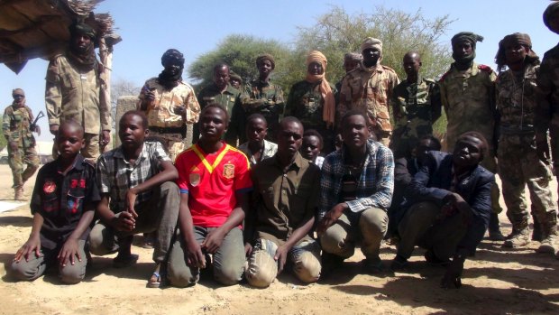 One-time Boko Haram members watched by Chadian soldiers last week.