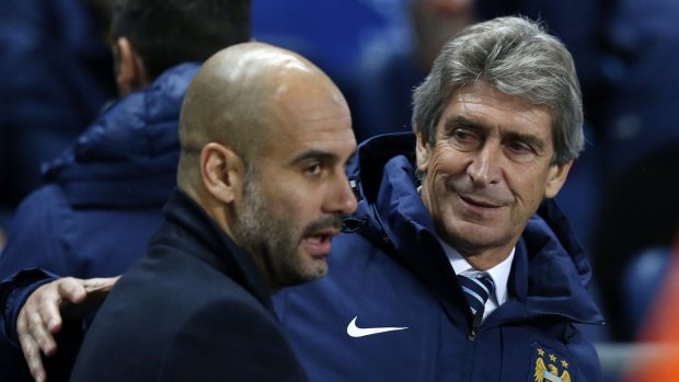 Passing the baton ... Manchester City's coach Manuel Pellegrini, right, speaks with Bayern Munich's coach Pep Guardiola before their Champions League group match at the Etihad Stadium, in Manchester, England in 2014. 