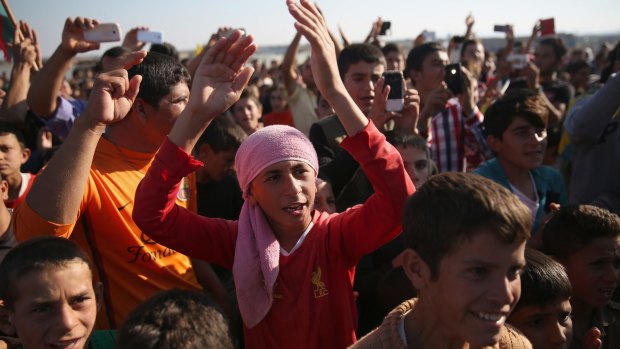 Yazidi refugees in Syria celebrate last month after hearing that Islamic State militants had been driven out of Sinjar.