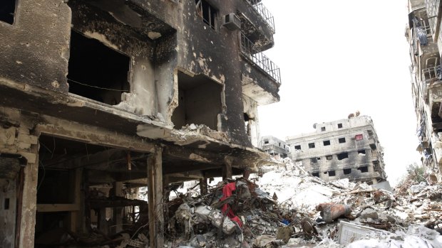 A deserted street during a Syrian regime-escorted visit to Yarmouk refugee camp on Thursday, April 9.