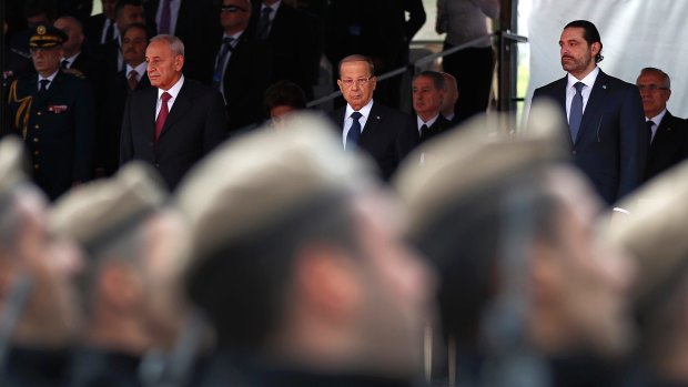 Parliament Speaker Berri, President Aoun and Lebanese PM Hariri attend a military parade to mark the 74th anniversary of Lebanon's independence from France.