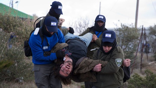 Hundreds of youths streamed into the outpost, ruled illegal by Israel's highest court, to fight the evacuation.